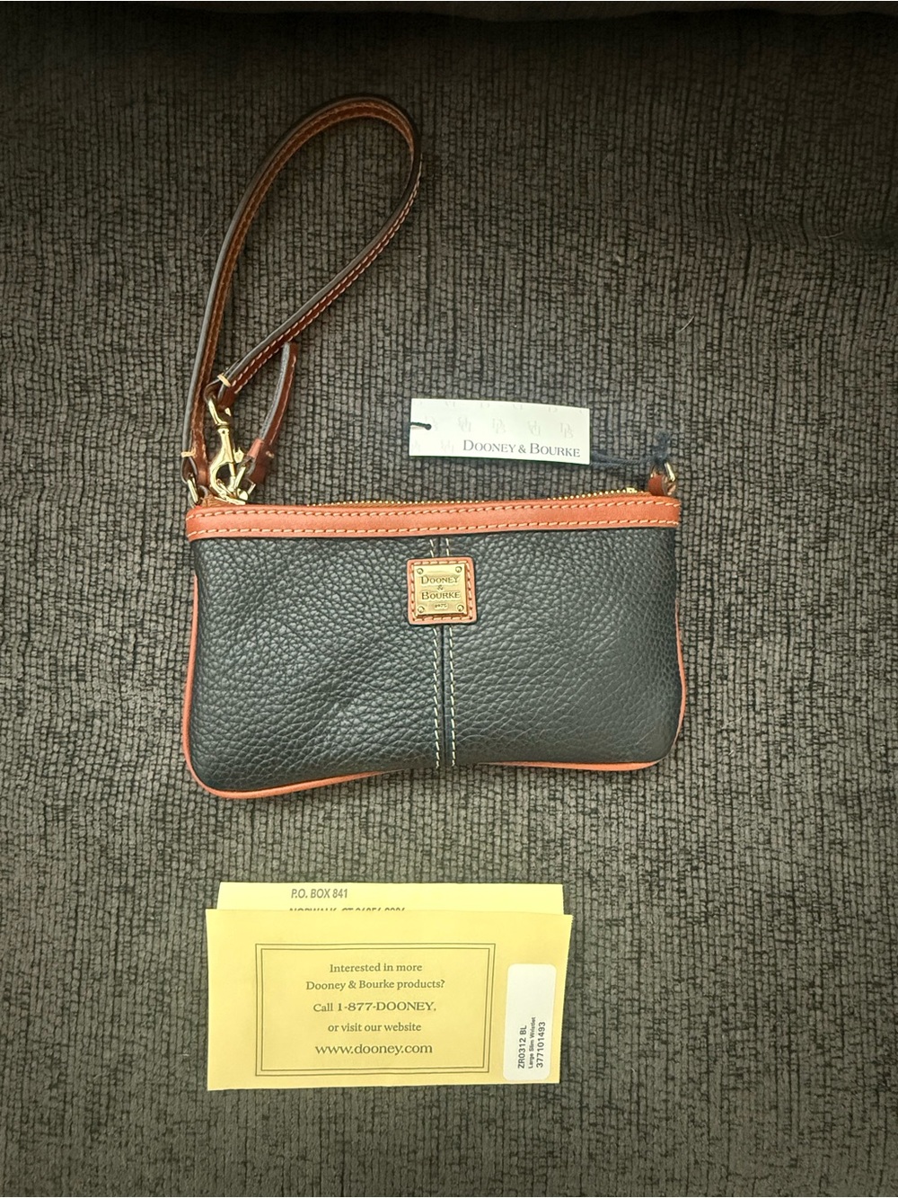 Dooney & Bourke Black Pebbled Leather Wristlet with Orange Trim